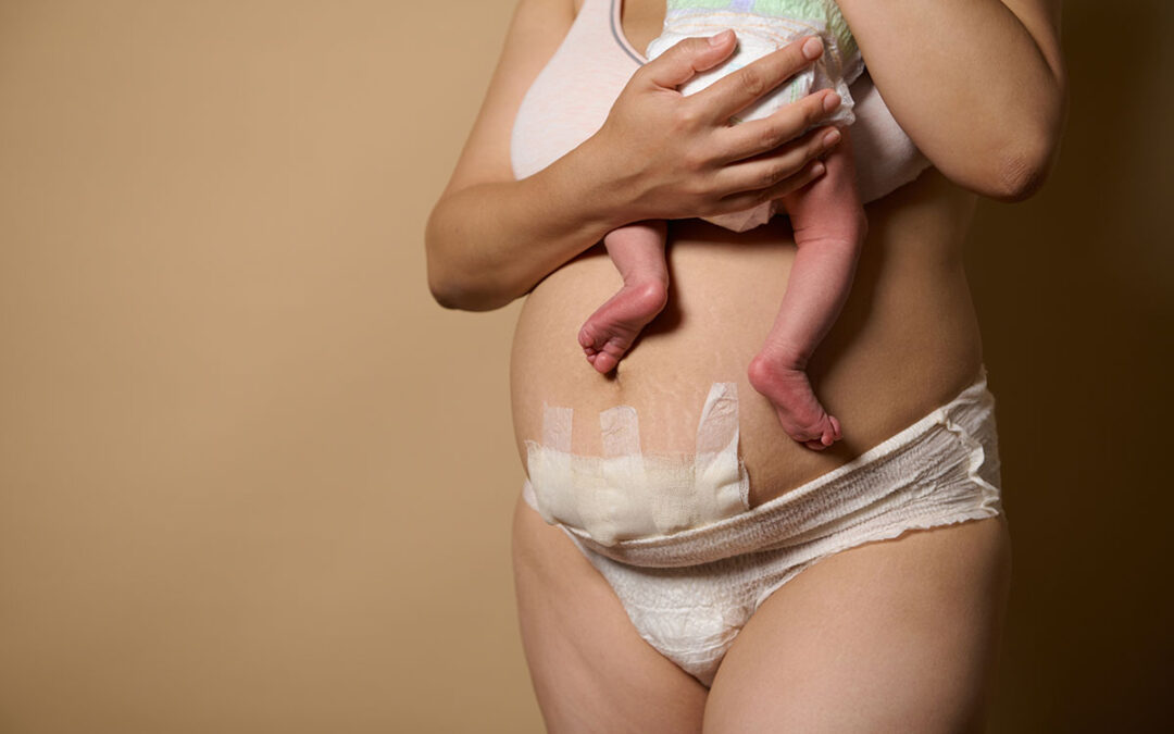 Mother standing together with her newborn baby